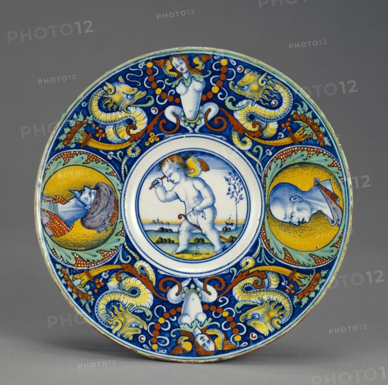 Dish with Cupid on a Hobbyhorse, Tondino, Possible Urbino area, Venice, or Pesaro, Italy; about 1510 - 1520; Tin-glazed