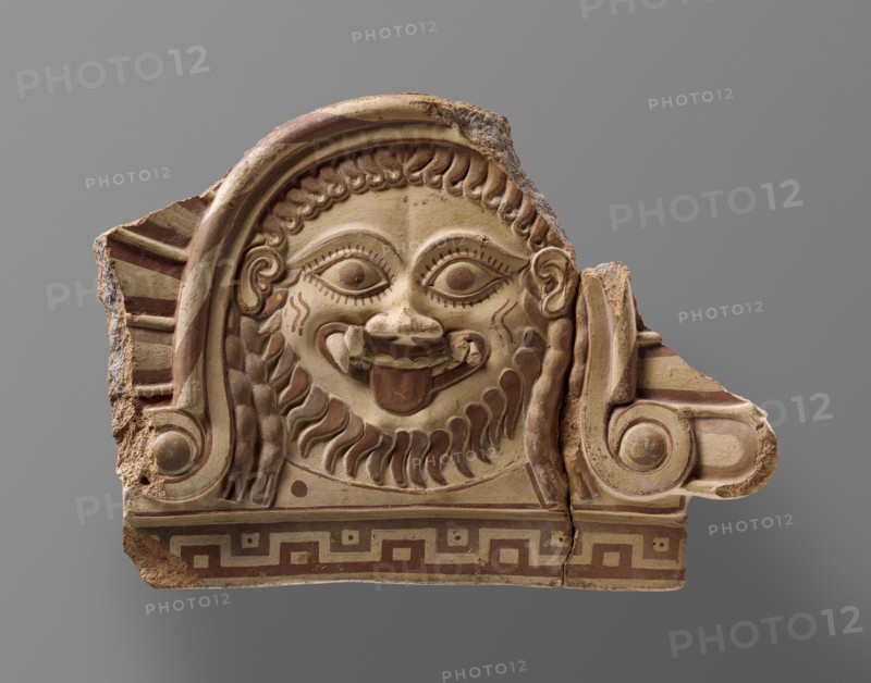 Fragmentary Roof Ornament with Medusa; Campania, Italy; about 500 B.C; Terracotta with polychromy; 26.2 × 39.1 × 6 cm
