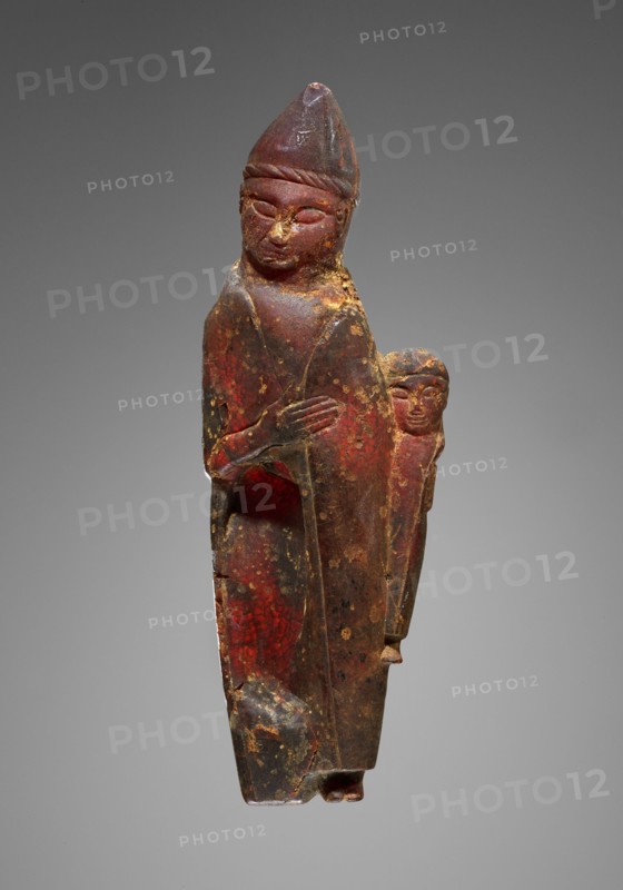 Pendant: Female Holding a Child, Kourotrophos, Italy; 600 - 550 B.C; Amber; 130 × 45 × 18 mm, 55.2 g, 5 1,8 × 1 3,4 × 11,16 in