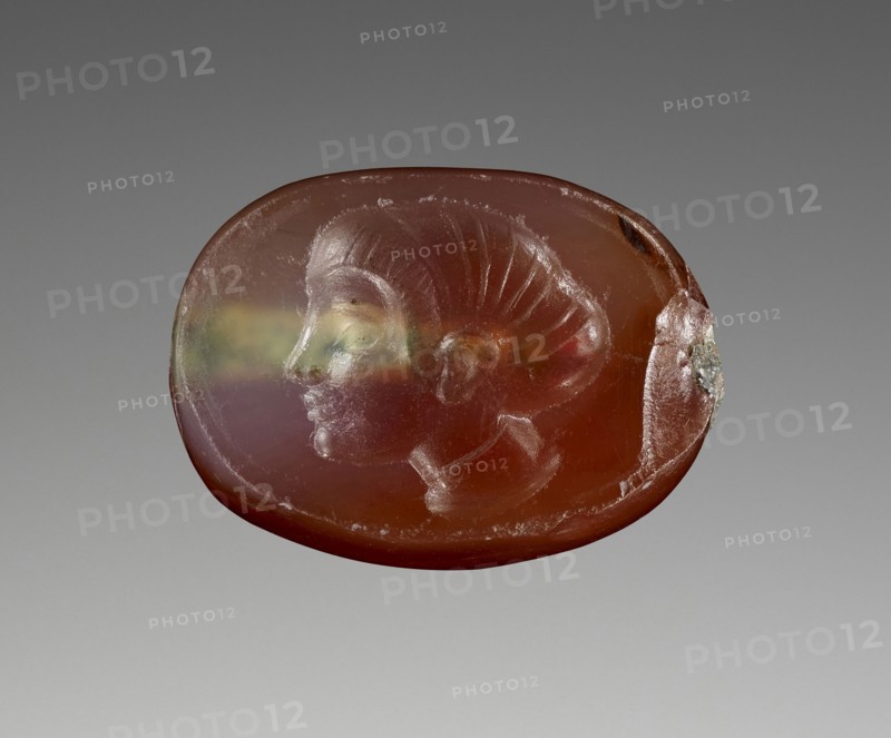 Engraved Scaraboid; 480 - 470 B.C; Carnelian with clear patches; 0.4 × 1 × 0.7 cm, 3,16 × 3,8 × 1,4 in