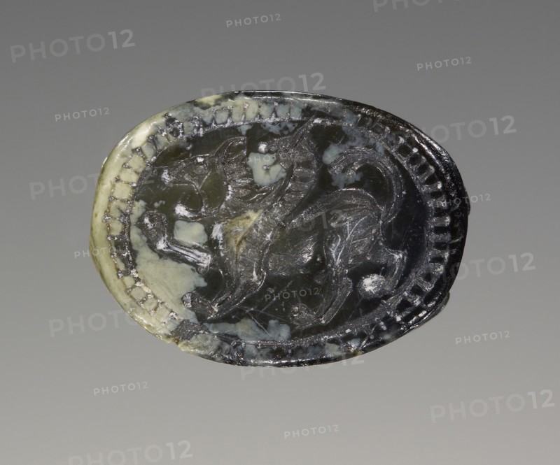 Scarab; 5th century B.C; Pale green mottled serpentine; 0.5 × 1 × 0.7 cm, 3,16 × 3,8 × 1,4 in