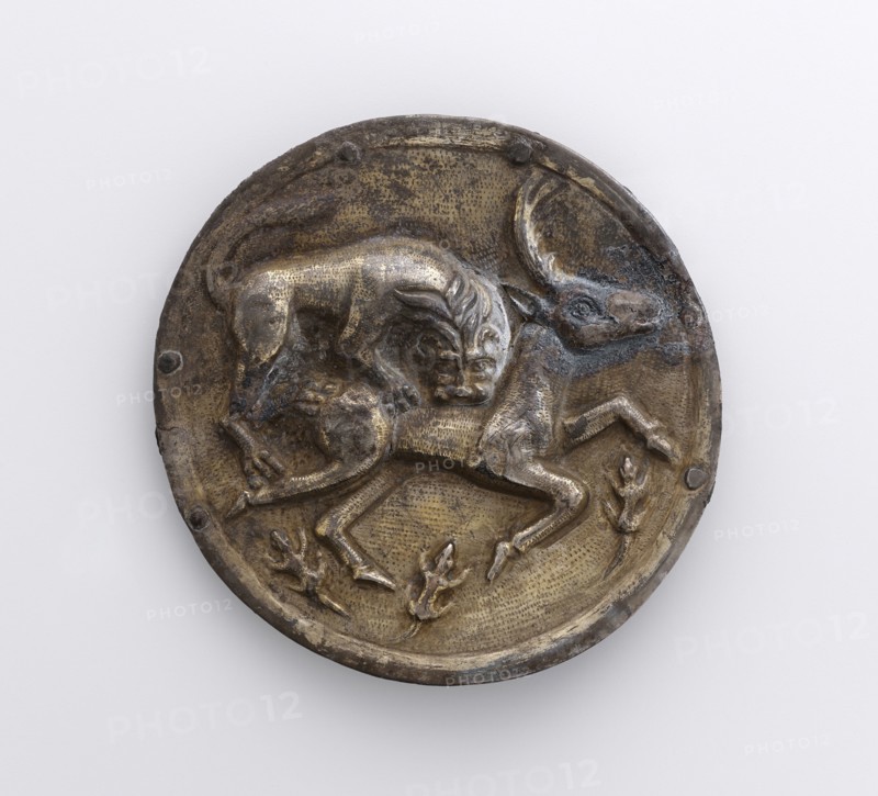 Phalera with Relief of Lion Attacking a Stag; Parthia; 2nd century B.C; Silver with gilding; 9 × 12.6 cm, 3 9,16 × 4 15,16 in