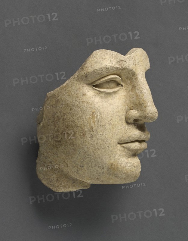 Fragment of a Head; Tarentum, Taras, South Italy; 440 - 430 B.C; Terracotta with clay slip; 14.2 × 14 cm, 5 9,16 × 5 1,2 in