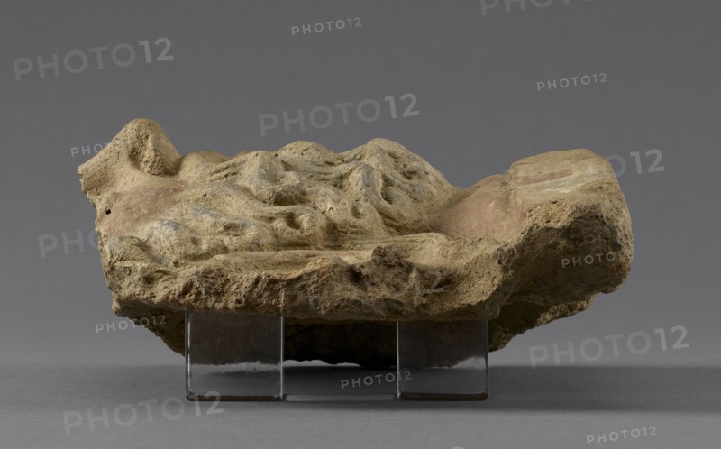 Fragmentary Antefix; Etruria; 4th century B.C; Terracotta; 14.8 × 16 × 7.2 cm, 5 13,16 × 6 5,16 × 2 13,16 in