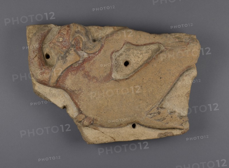 Mutulus plaque with Triton; Etruria; 510 - 475 B.C; Terracotta; 29.5 × 49.3 × 5.1 cm, 11 5,8 × 19 7,16 × 2 in