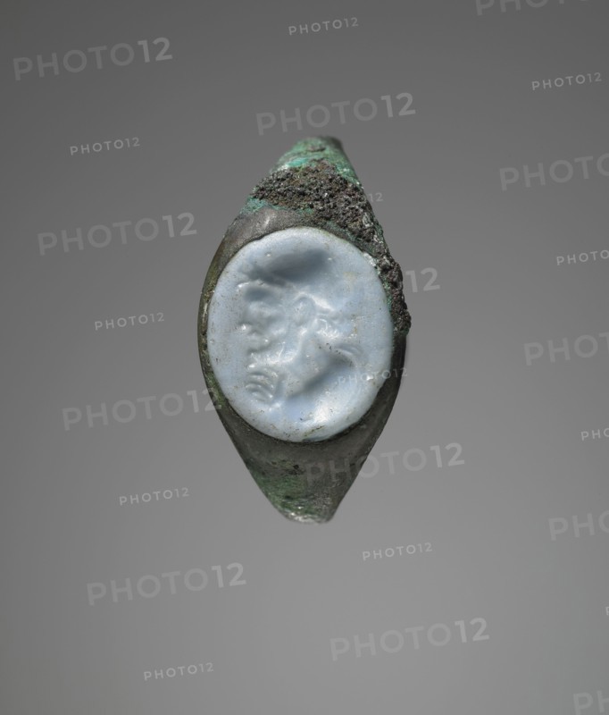 Molded Gem Inset Into Fragmentary Ring; Roman Empire; second half of 1st century B.C; Gem: pale blue opaque glass; ring: bronze