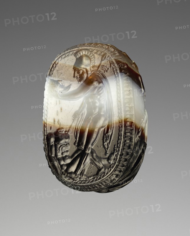 Engraved Scarab; Etruria; 400 - 380 B.C; Banded brown and white agate; 1.1 × 0.9 × 1.7 cm, 7,16 × 5,16 × 5,8 in