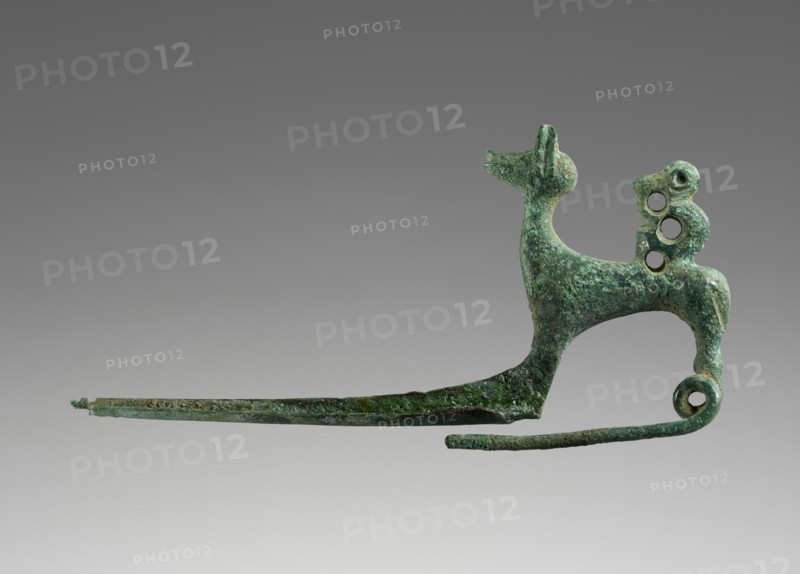 Pin Shaped as a Dog with a Monkey; Etruria; 700 - 650 B.C; Bronze; 3.8 × 7.6 × 2 cm, 1 1,2 × 3 × 13,16 in