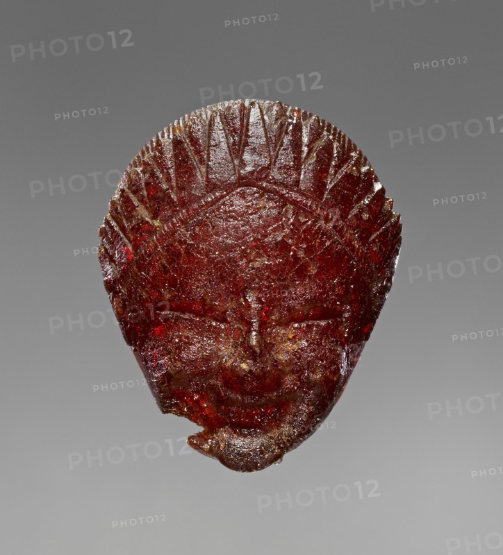 Pendant: Head of a Female Divinity or Sphinx; Italy; 550 - 525 B.C; Amber; 32 × 26 × 12 mm, 1 1,4 × 1 × 1,2 in