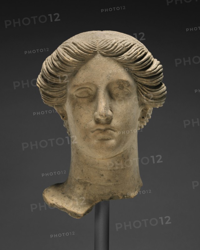 Head of a Woman; Tarentum, Taras, South Italy; about 350 B.C; Terracotta with clay slip and polychromy, red, 23.5 × 17.2 cm