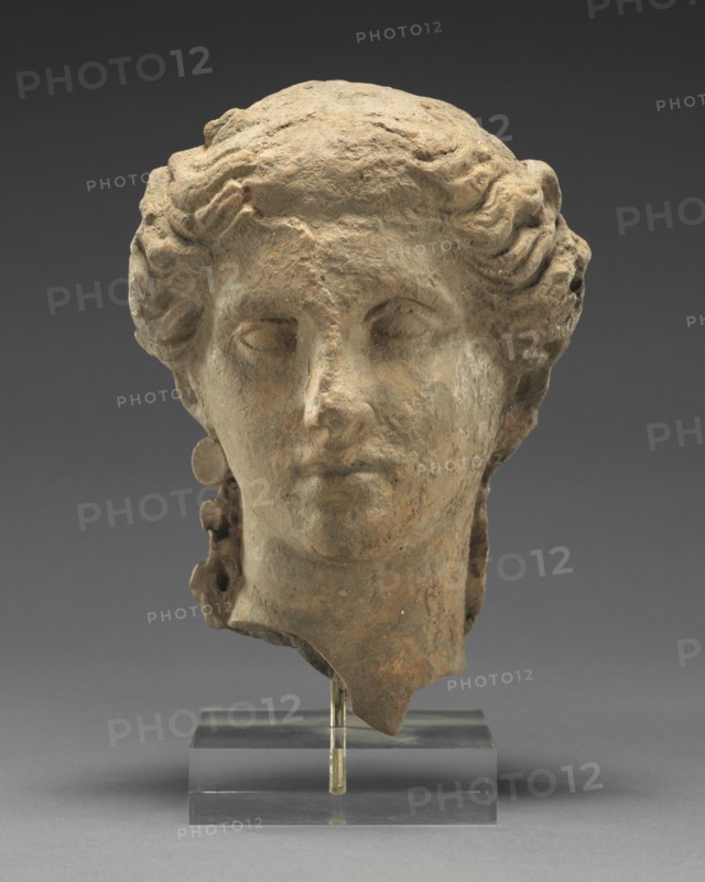 Head of a Woman; Tarentum, Taras, South Italy; 350 - 300 B.C; Terracotta with clay slip; 17.3 × 12.3 cm, 6 13,16 × 4 13,16 in