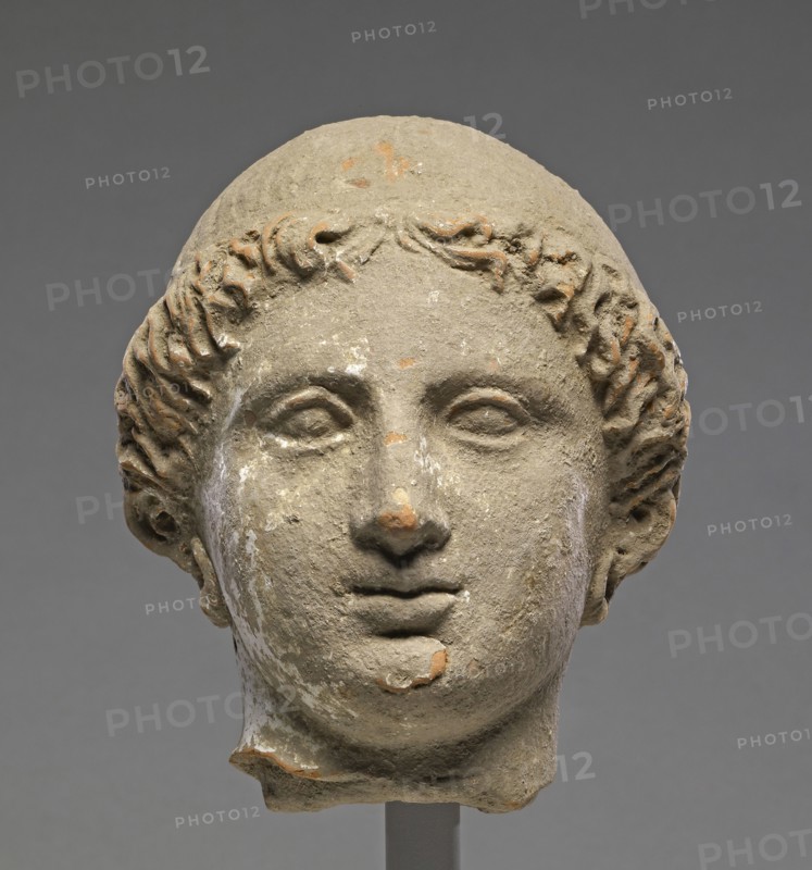 Head of a Woman; Tarentum, Taras, South Italy; 350 - 300 B.C; Terracotta with white slip; 14.4 × 11.5 cm, 5 11,16 × 4 1,2 in