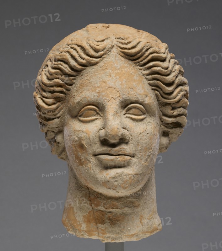 Head of a Woman; Orpheus Master; Tarentum, Taras, South Italy; 350 - 300 B.C; Terracotta with clay slip; 16.5 × 12.6 cm