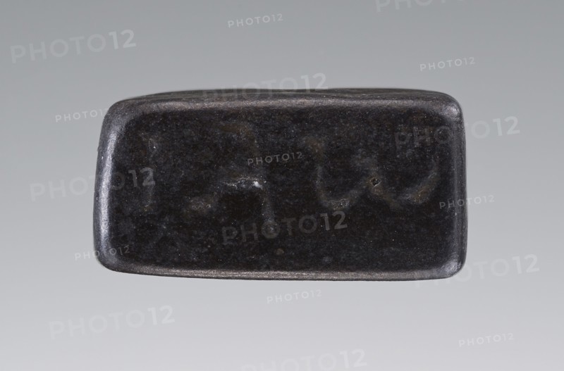 Bulla; Roman Empire; 2nd - 4th century; Indeterminate, probably a composite material; 2 x 1 x 1 cm, 3,4 x 3,8 x 3,8 in