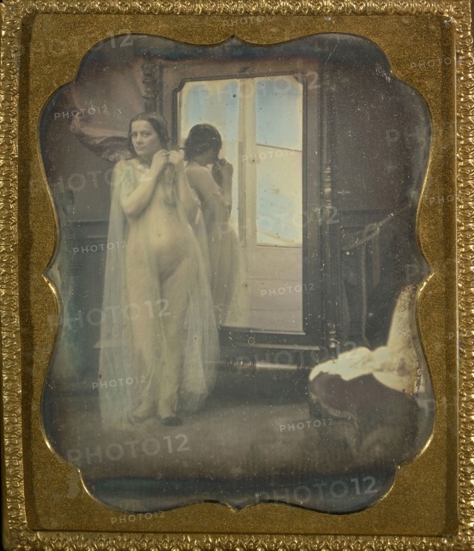 Female Nude at Mirror; French; 1850 - 1852; Daguerreotype, hand-colored; 6.4 x 5.7 cm 2 1,2 x 2 1,4 in