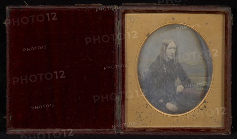 Portrait of a young woman with long curls; Beard & Foard; 1856 - 1857; Daguerreotype, hand-colored