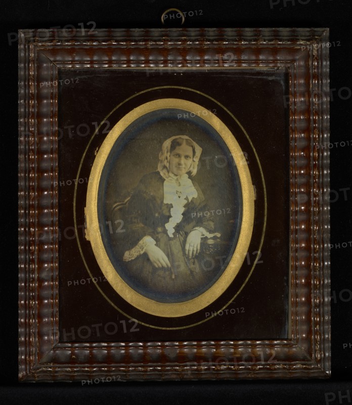 Portrait of a female wearing a lace cap; J.J. Burbach; 1850; Daguerreotype, hand-colored