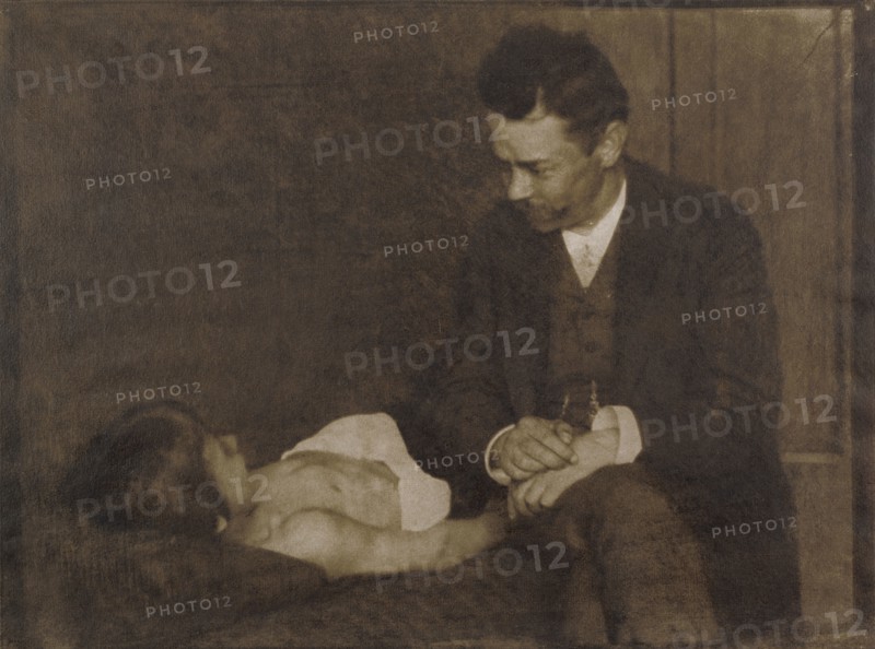Man Seated Beside Supine Child; Heinrich Kühn, Austrian, born Germany, 1866 - 1944, 1900 - 1910; Gum bichromate print