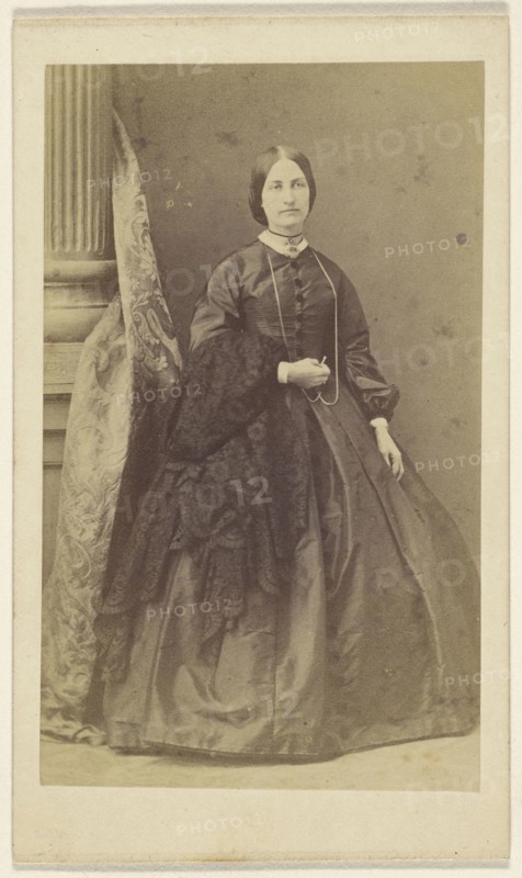 woman in long black dress, standing; F. Schwarzschild, British, active Calcutta, India 1860s, about 1865; Albumen silver print