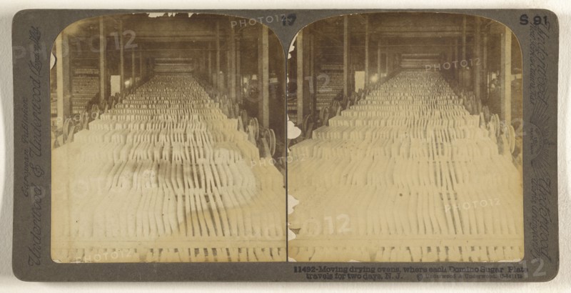 Moving drying ovens, where each Domino Sugar Plate travels for two days, N.J; Underwood & Underwood, American, 1881 - 1940s
