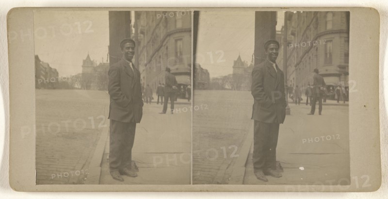 Black man posed on street at light pole, Albany, N.Y; Julius M. Wendt, American, active 1900s - 1910s, 1900s; Gelatin silver