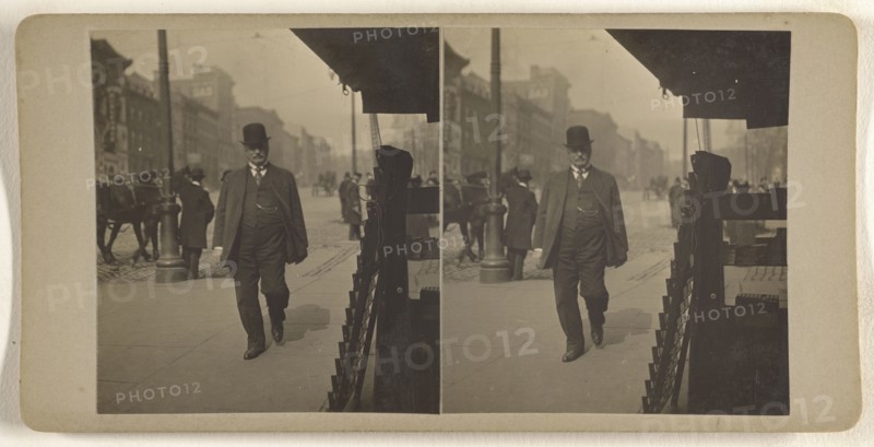 Man in derby walking down street, Albany, N.Y; Julius M. Wendt, American, active 1900s - 1910s, 1900s; Gelatin silver print