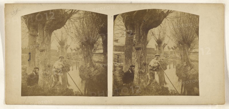 Boy at river with pole, bearded man with beret on riverbank; British; about 1860; Albumen silver print