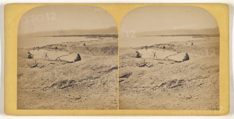 Men sitting by a body of water, possibly in the Middle East; about 1870; Albumen silver print
