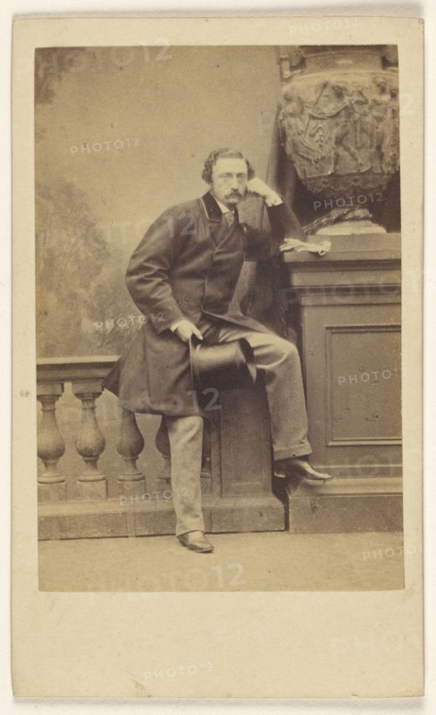 Man with moustache, holding a top hat, standing, posed on railing in studio; Antoine Claudet, French, 1797 - 1867, about 1865
