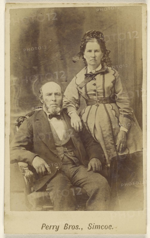 couple: bearded man, seated and woman, standing; E.B. Perry Brothers; 1860s; Albumen silver print