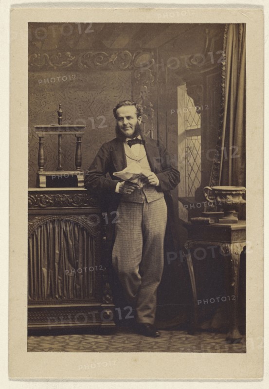 man with muttonchops, standing, holding a newspaper; Camille Silvy, French, 1834 - 1910, 1860s; Albumen silver print