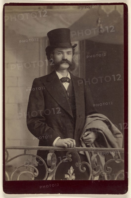 man with moustache and muttonchops wearing fancy clothes and a top hat; about 1885; Albumen silver print