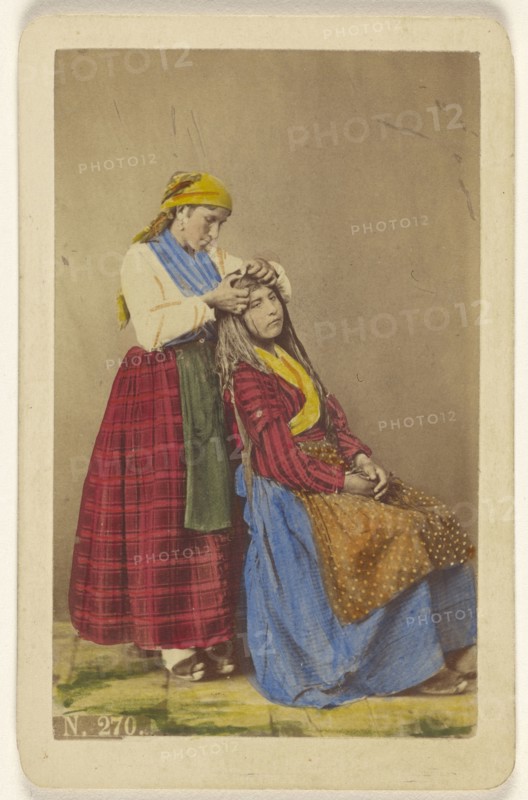 Older woman doing the hair of a younger woman; Giorgio Conrad, Italian, active 1860s, about 1870; Hand-colored albumen silver