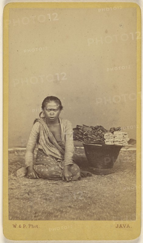 Javanese woman seated with legs crossed, basket at side; Woodbury & Page, British, active 1857 - 1908, about 1870; Albumen