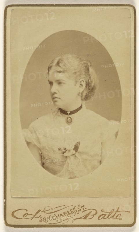 woman with cameo around her neck, in profile, printed in oval format; Cox & Batto; 1865 - 1870; Albumen silver print