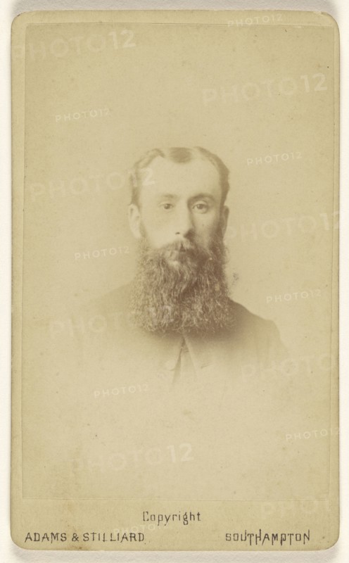 man with a long, square-cut beard, printed in vignette-style; Adams & Stilliard; May 1877; Albumen silver print