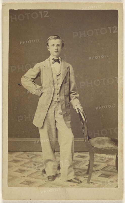 well-dressed young man wearing a bowtie, standing; 1861; Albumen silver print