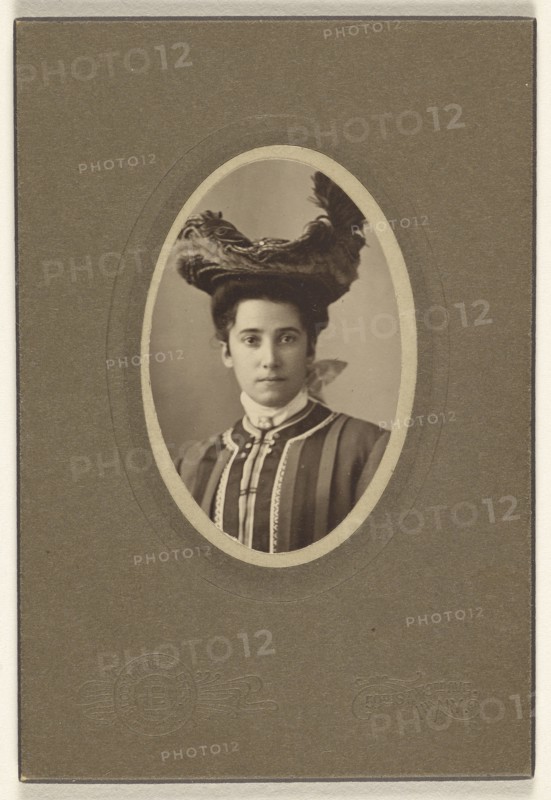 woman wearing a feathered hat, printed in oval cut; Bloomingdale Brothers; October 1904; Gelatin silver print