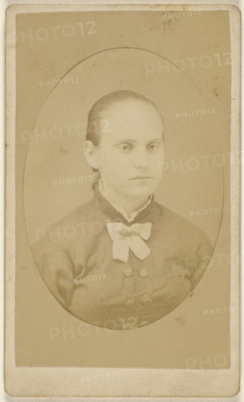 woman with her hair pulled back, printed in quasi-oval style; 1870 - 1875; Albumen silver print