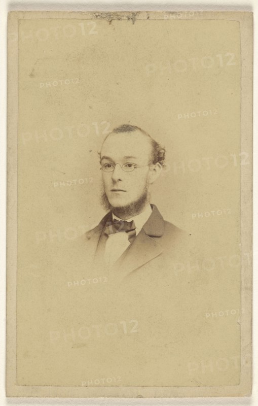 chin-bearded man wearing wire-rimmed glasses, printed in vignette-style; James Cremer & James Dillon; 1870-1875; Albumen silver
