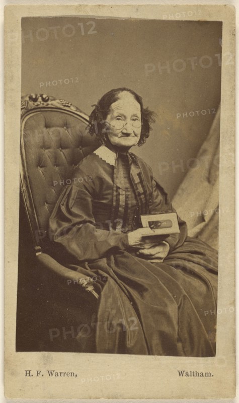 Elderly woman holding a photograph; Henry F. Warren, American, active 1860s - 1870s, Waltham, Massachusetts, United States