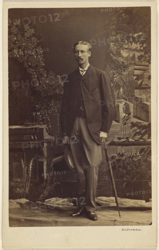man with moustache, holding a top hat and umbrella, standing; Southwell Brothers, English, 1862 - 1878, 1863 - 1864; Albumen