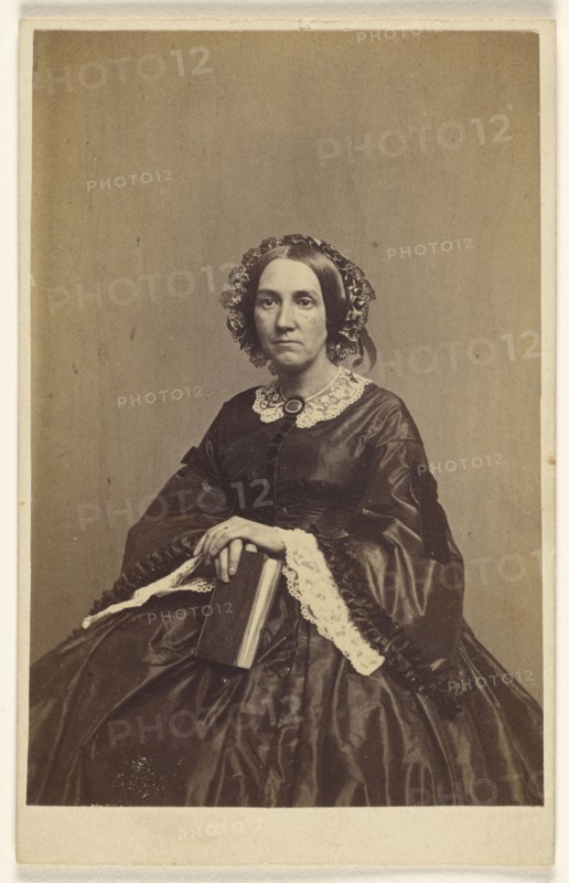 woman holding a book, seated; K.W. Beniczky, American, active New York, New York 1850s - 1860s, 1865 - 1870; Albumen silver