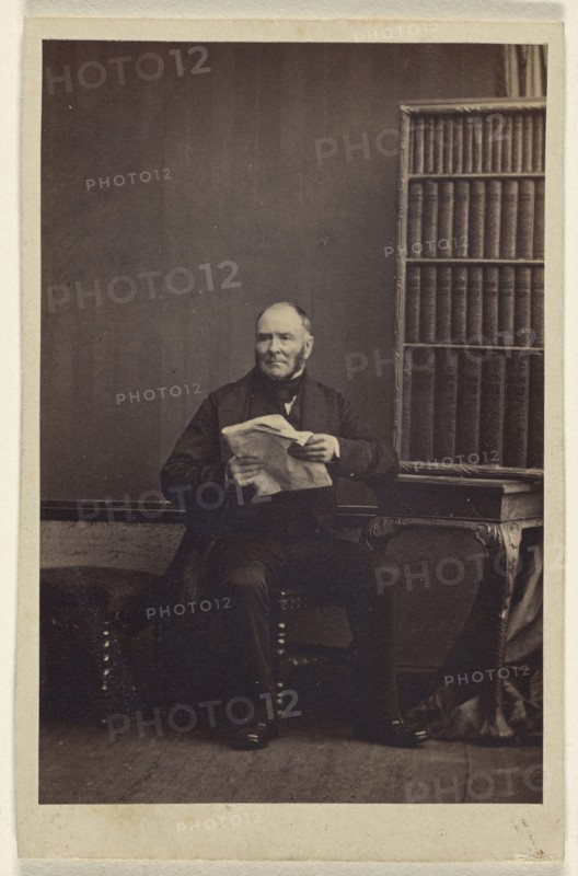 man seated, holding a newspaper; Camille Silvy, French, 1834 - 1910, about 1866; Albumen silver print