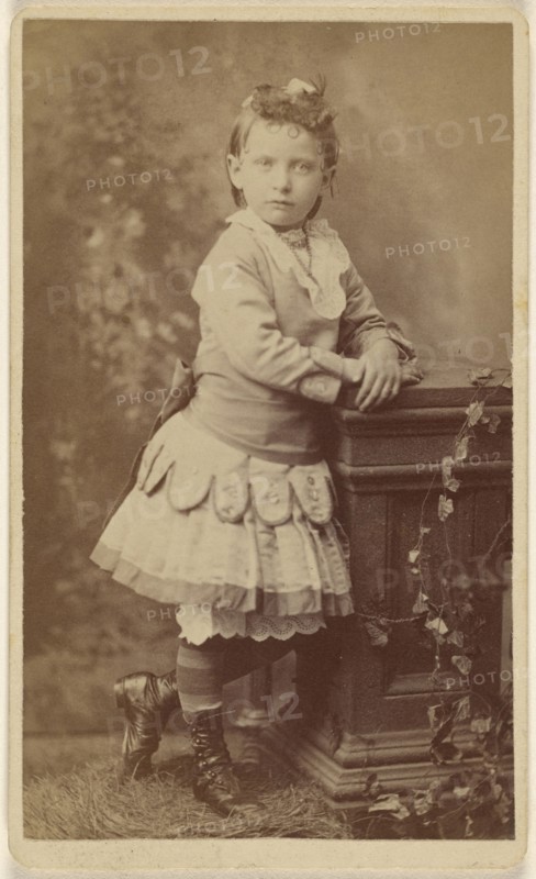little girl, standing, leaning on a studio prop; Lee Stearns, American, active 1870s - 1910s, 1870 - 1875; Albumen silver print