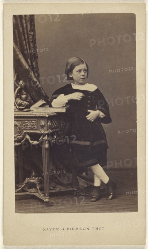 little girl standing, elbow on top of a closed book on a table; Mayer & Pierson, French, active 1855 - 1878, 1865 - 1870