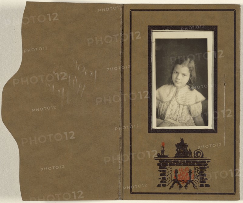 little girl seated with an open book in her lap; Housh Company, Inc., American, active 1910 - 1925, 1910-1925; Gelatin silver