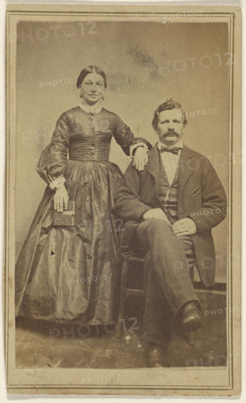 couple: woman standing holding a book and a man with moustache seated; J.W. Smith, American, active Lewistown, Pennsylvania