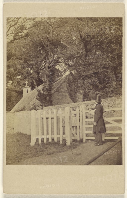 man wearing a top hat standing at a gate viewing a house and trees; F. Moor, English, active Ventnor, Isle of Wight, England