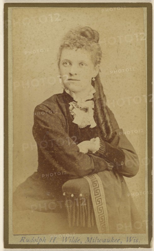 woman seated with arms crossed on chair arm; Rudolph H. Wilde, American, active Milwaukee, Wisconsin 1860s, 1865 - 1875